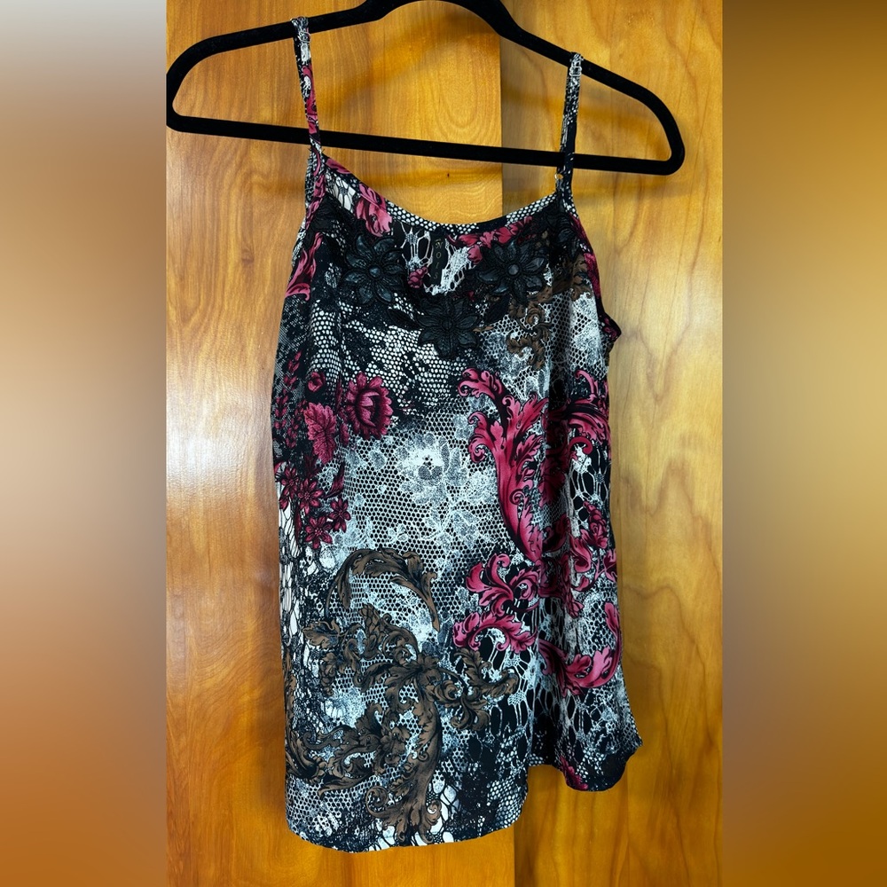 Elegant camisole top with a stunning floral and lace print.